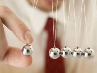 bigstock-businessman-holding-a-pendulum-22441409
